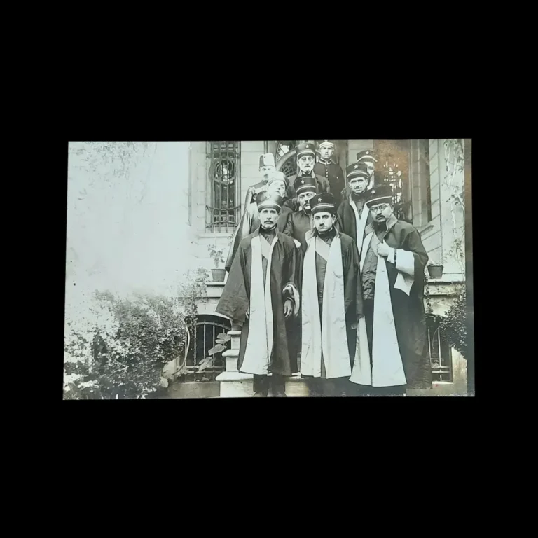 Group photograph of civil court presiding judges in robes and star-adorned caps, taken on a staircase