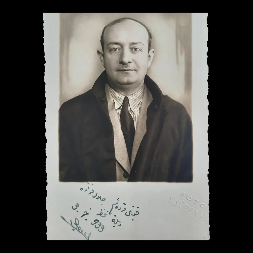 Portrait of a lawyer in an overcoat and tie; below, an Ottoman Turkish dedication, the date 3.7.933 and a signature