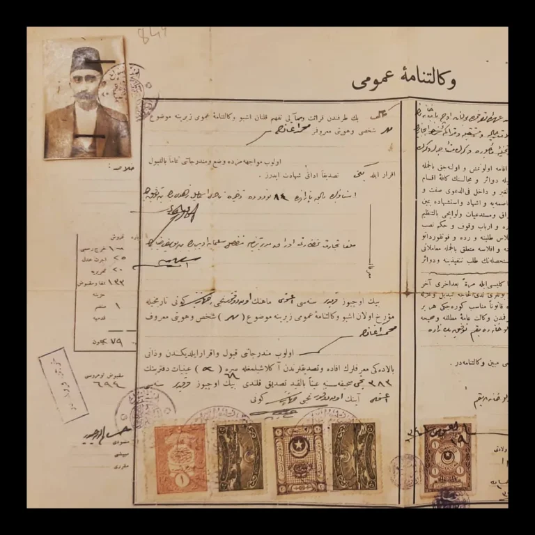 Ottoman Turkish general power of attorney bearing revenue stamps and seals, with a photograph of a man in a fez attached
