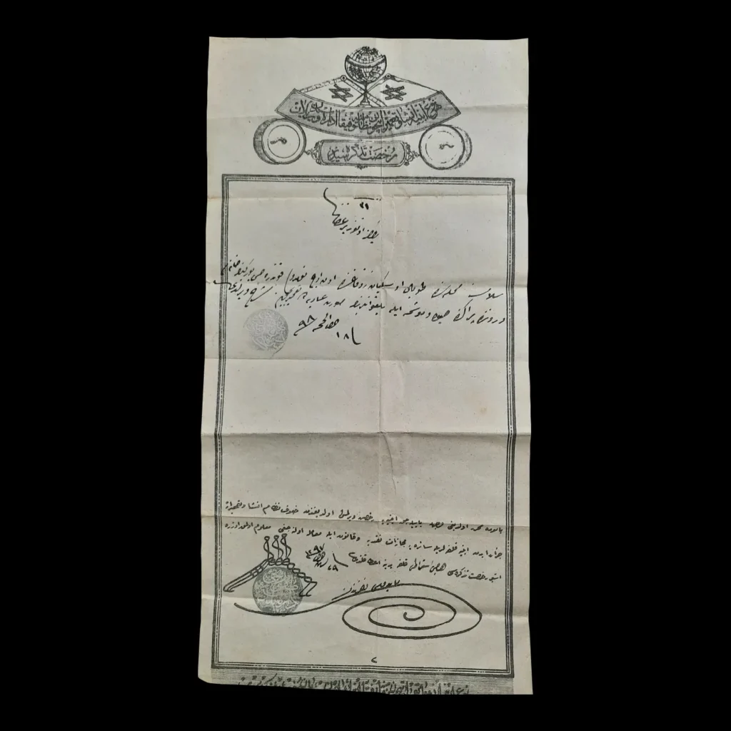 Permiso de reparación en turco otomano con encabezado impreso con emblema de un globo, sellos y anotaciones manuscritas