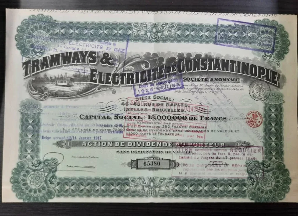 Yeşil bordürlü "Tramways & Électricité de Constantinople" hisse senedi; tramvay gravürü ve mor damgalar
