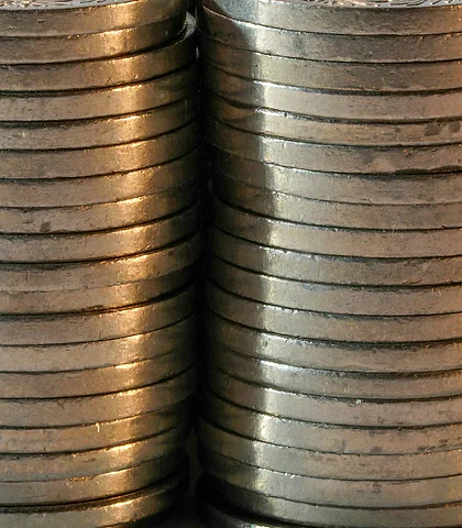 Edges of coin stacks lined up side by side
